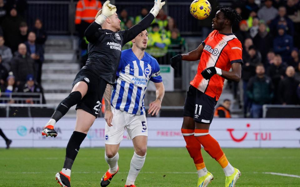 Luton Town's Elijah Adebayo scores their first goal against Brighton