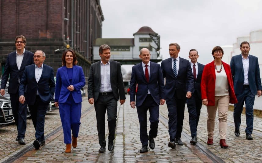 Olaf Scholz, centre, the incoming German chancellor - ODD ANDERSEN/AFP