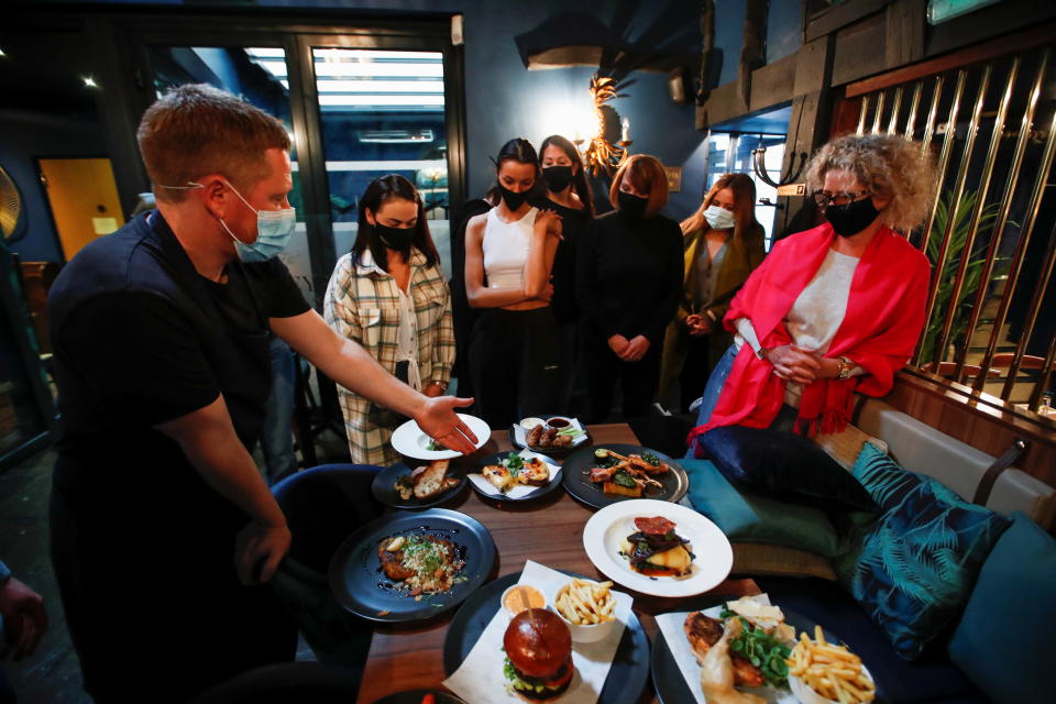 Staff at Loxley's Restaurant & Wine Bar take part in a new menu tasting and training before reopening on Monday 17th, as coronavirus disease (COVID-19) restrictions continue to ease, in Stratford Upon Avon, Britain, May 14, 2021. REUTERS/Andrew Boyers