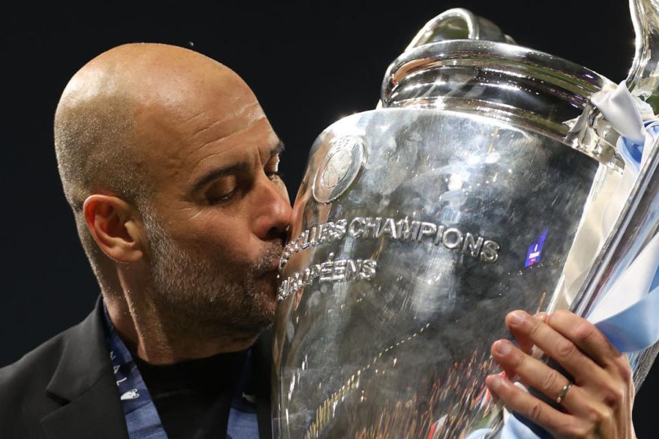 Pep Guardiola kisses the Champions League trophy after victory over Inter in Istanbul in June (Getty)