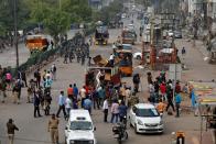 Police clear the site of the longest-running protest against a new citizenship law following the lockdown by Delhi state government, in New Delhi