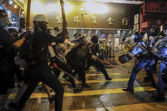 Police officers clash with demonstrators 