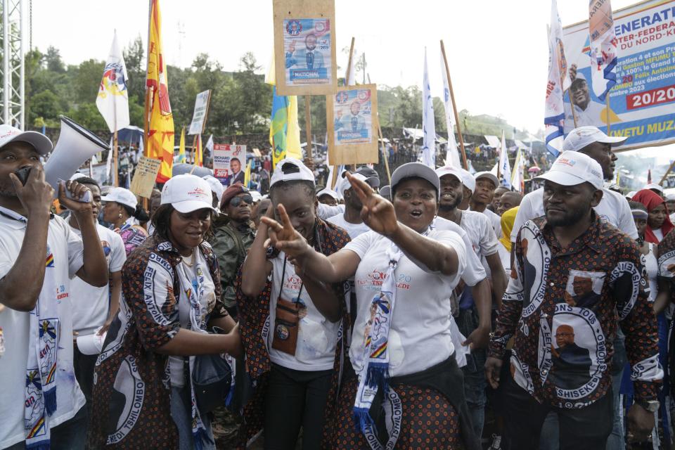 Supporters wait for the arrival of Democratic Republic of the Congo President Felix Tshisekedi at a rally in Goma, Eastern Congo, Sunday, Dec. 10, 2023. Tshisekedi is seeking reelection in the Dec. 20 elections. (AP Photo/Moses Sawasawa)