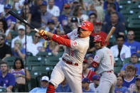 Cincinnati Reds' Joey Votto hits a home run against the Chicago Cubs during the first inning of a baseball game, Tuesday, July 27, 2021, in Chicago. (AP Photo/David Banks)