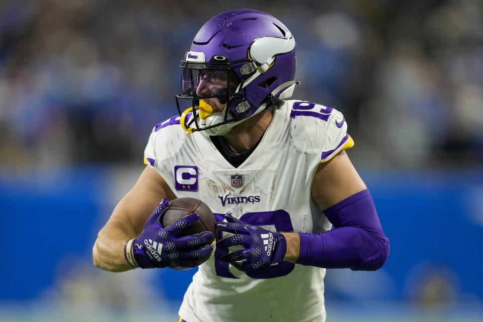 Minnesota Vikings' Adam Thielen catches a touchdown pass during the second half of an NFL football game against the Detroit Lions Sunday, Dec. 11, 2022, in Detroit. (AP Photo/Paul Sancya)