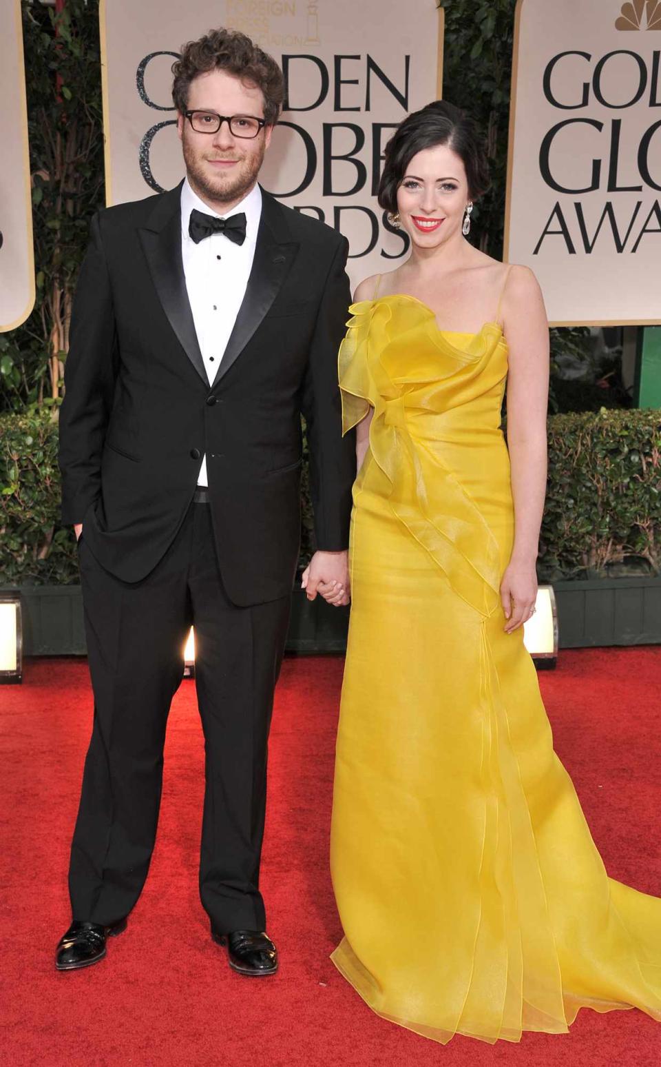 Seth Rogen and wife Lauren Miller arrive at the 69th Annual Golden Globe Awards at The Beverly Hilton hotel on January 15, 2012 in Beverly Hills, California