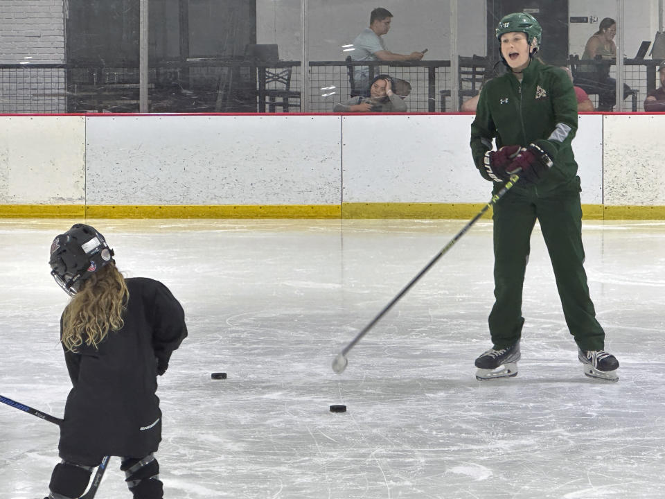 Lyndsey Fry coaches during an Arizona Kachinas hockey practice at Arizona Made Ice Forum in Mesa, Ariz., May 1, 2024. The 2014 Olympian has created the Matt Shott Arizona Hockey Legacy Foundation to support boys and girls hockey programs after the Arizona Coyotes moved to Utah. (AP Photo/John Marshall)