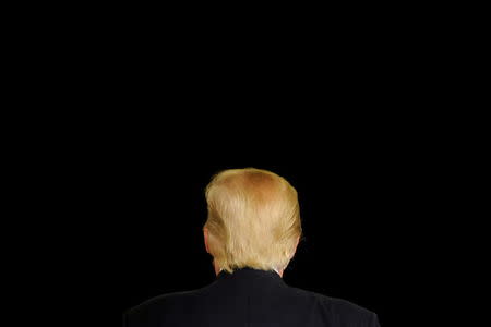 Republican U.S. presidential candidate Donald Trump turns away from the cameras as he speaks at a town hall event in Appleton, Wisconsin, March 30, 2016. REUTERS/Mark Kauzlarich