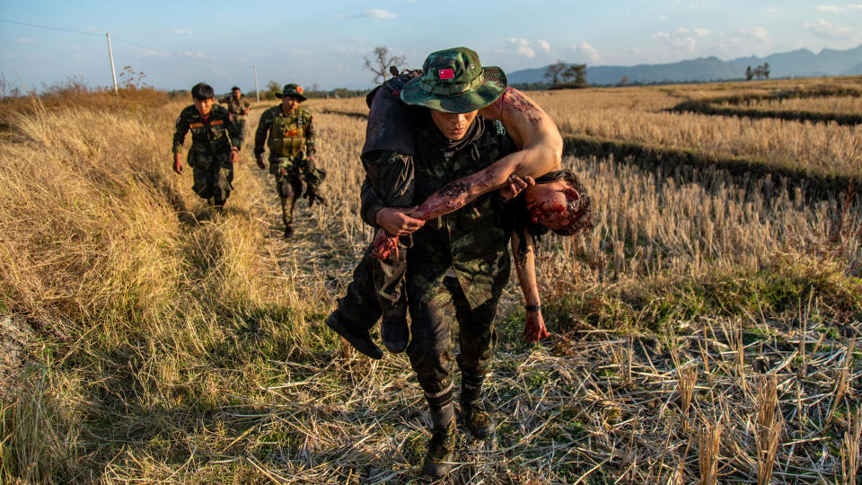 Retrieving the Dead. Resistance fighters from the People's Defence Force retreat with the body of a comrade, following a clash with the Myanmar military, in Moe Bye, Kayah State. Myanmar authorities have sent reinforcements to the region as fighting with the local opposition groups intensifies.