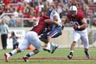 Quarterback Matt Scott #10 of the Arizona Wildcats is sacked by defensive end Ben Gardner #49 of the Stanford Cardinal during the second quarter at Stanford Stadium on October 6, 2012 in Palo Alto, California. (Photo by Jason O. Watson/Getty Images)