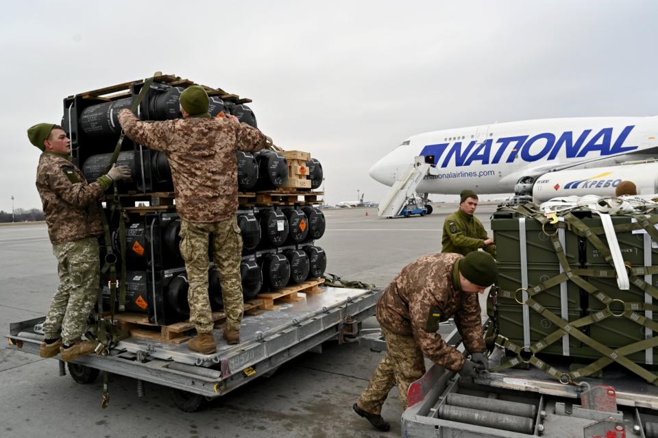 <span>Ukrainian servicemen receive the delivery of FGM-148 Javelins, a man-portable anti-tank missile provided by the US to Ukraine as part of military support at Kyiv's airport Boryspil on February 11, 2022.</span><div><span>SERGEI SUPINSKY</span><span>AFP</span></div>