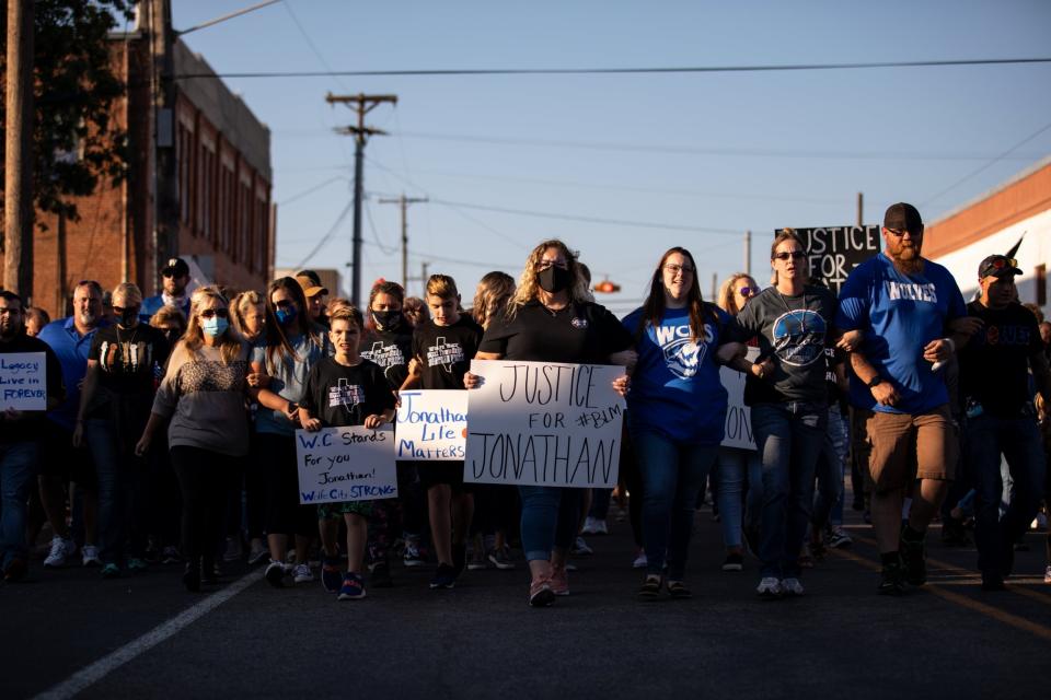 People gather for a march, rally and candle light vigil in honor Jonathan Price (Getty Images)