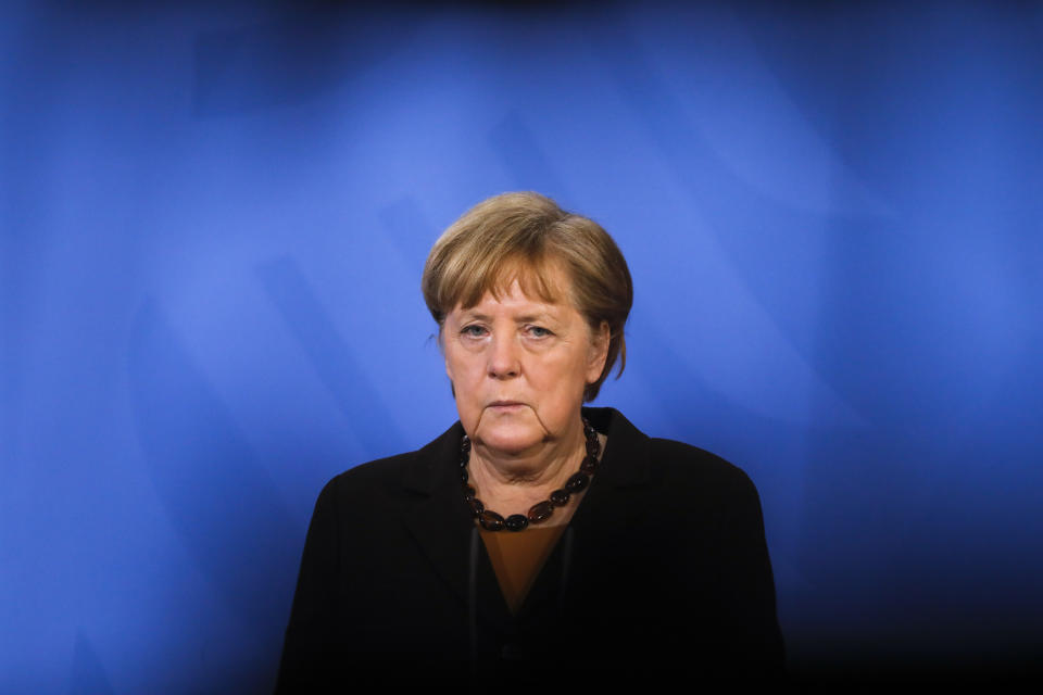 FILE - German Chancellor Angela Merkel briefs the media after a virtual meeting with federal state governors about the coronavirus pandemic at the chancellery in Berlin, Germany, Tuesday, March 30, 2021. Germany is set to mark 100,000 deaths from COVID-19 this week, passing a somber milestone that several of its neighbors crossed months ago but which some in Western Europe's most populous nation had hoped to avoid. (AP Photo/Markus Schreiber, Pool, File)