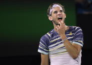 Austria's Dominic Thiem watches video replay of a line call during his quarterfinal match against Spain's Rafael Nadal at the Australian Open tennis championship in Melbourne, Australia, Wednesday, Jan. 29, 2020. (AP Photo/Andy Brownbill)