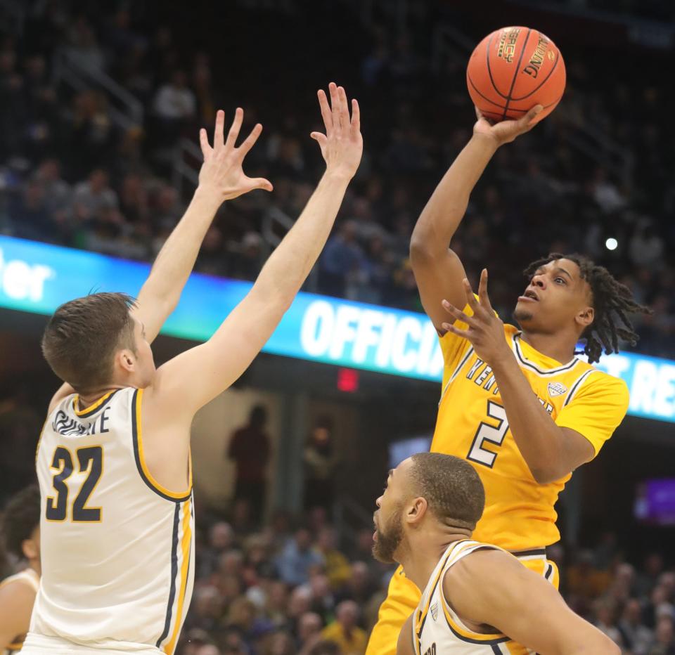 Toledo's JT Shumate defends a shot by Kent's Malique Jacobs in the MAC championship game Saturday, March 11, 2023 in Cleveland.