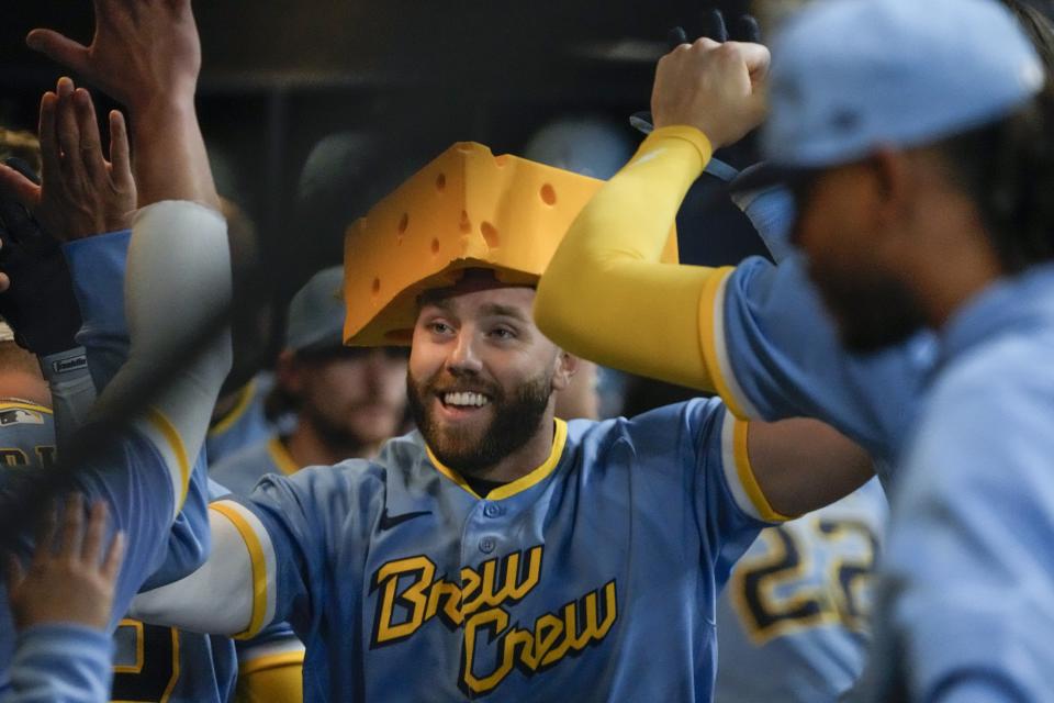 Milwaukee Brewers' Owen Miller is congratulated after hitting a home run during the third inning of a baseball game against the Kansas City Royals Friday, May 12, 2023, in Milwaukee. (AP Photo/Morry Gash)