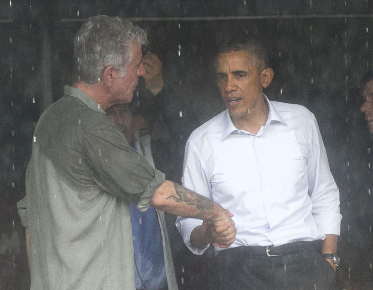 U.S. President Barack Obama and Anthony Bourdain shake hands at a shopping area in Hanoi, Vietnam on May 24, 2016. The former president taped the second part of an interview with Bourdain before leaving the Vietnamese capital for Ho Chi Minh City.
