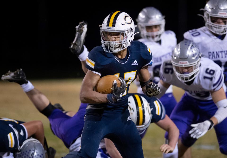 Castle’s Antonio Harris (17) finds a hole against Bloomington South during their IHSAA Class 5 regional game at John Lidy Field in Paradise, Ind., Friday night, Nov. 11, 2022.