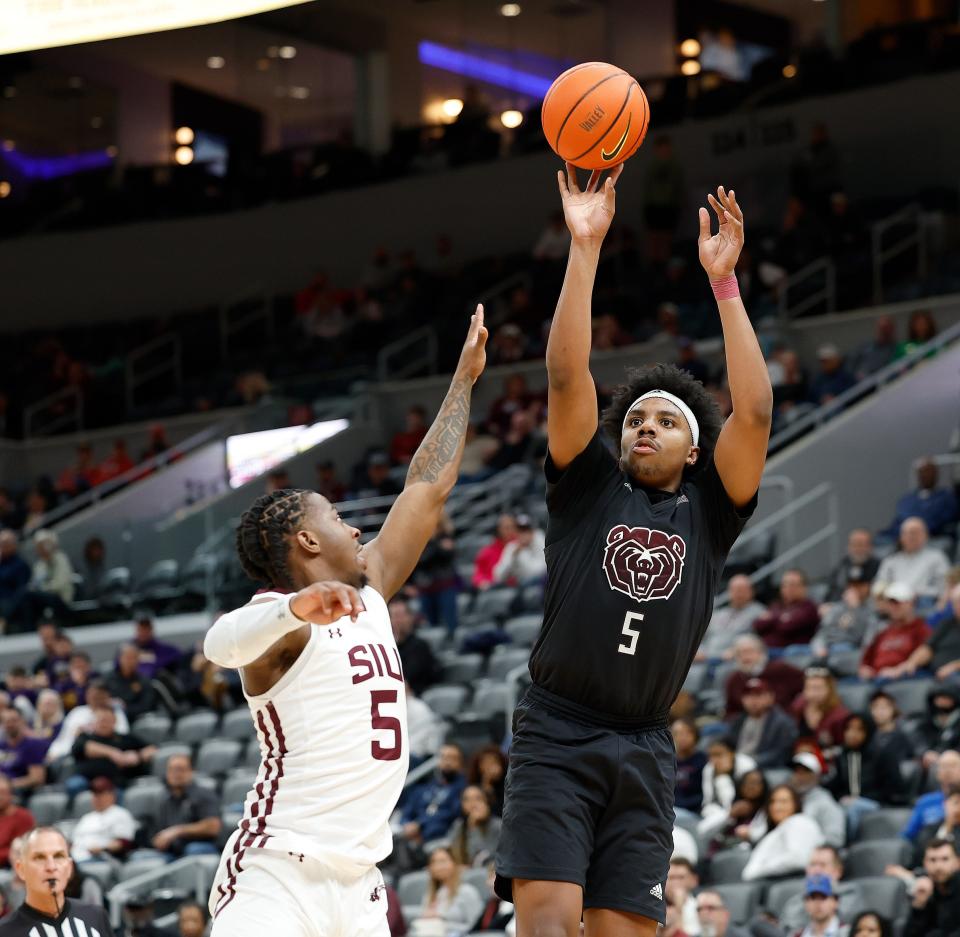 Missouri State's Donovan Clay (5) puts up a shot defended by Southern Illinois' Lance Jones (5)during a Missouri Valley Conference Tournament game, Friday, March 3, 2023, at Enterprise Center in St. Louis. 