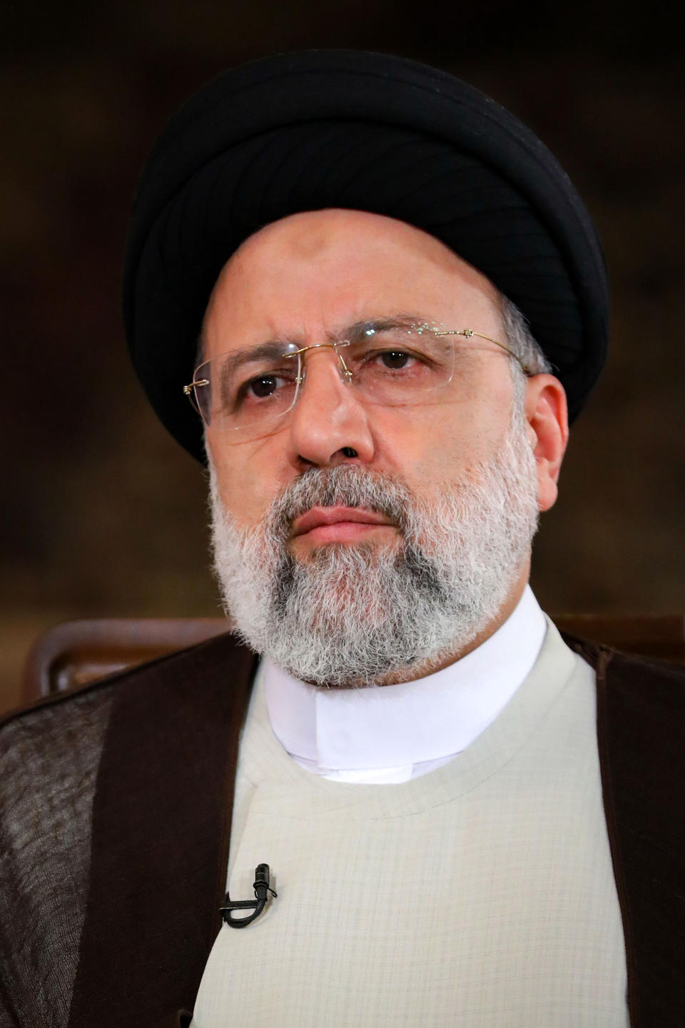 In this photo released by the official website of the office of the Iranian Presidency, President Ebrahim Raisi attends an interview with the state TV at the presidency office in Tehran, Iran, Wednesday, Sept. 28, 2022. Raisi again vowed to investigate death of Mahsa Amini, whose death in morality police custody over his veil, but said authorities would not tolerate any threats to public security. Amini's death sparked nearly two weeks of widespread unrest that has reached across Iran's provinces and brought students, middle-class professionals and working-class men and women into the streets. (Iranian Presidency Office via AP)