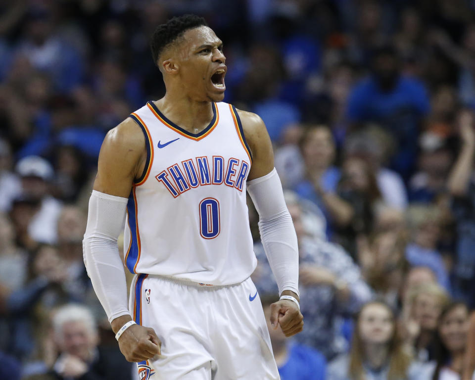 Oklahoma City Thunder guard Russell Westbrook shouts to the crowd in the first half of an NBA basketball game against the Denver Nuggets in Oklahoma City, Friday, March 30, 2018. (AP Photo/Sue Ogrocki)