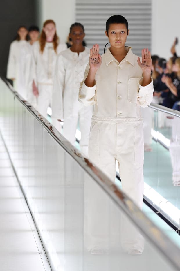 Ayesha Tan Jones protests the Gucci Spring 2020 show in Milan. Photo: Jacopo Raule/Getty Images