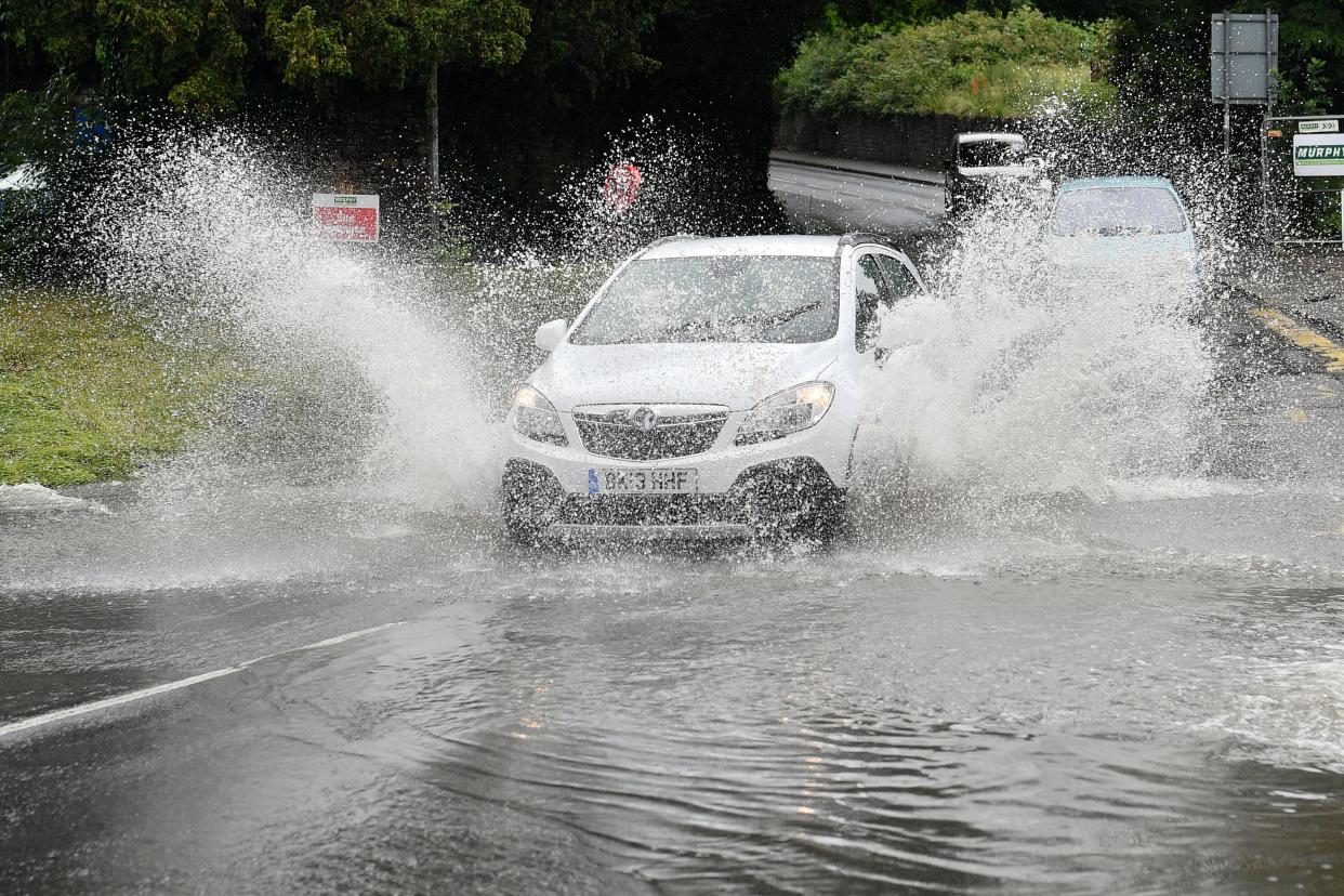 Car driving in rain