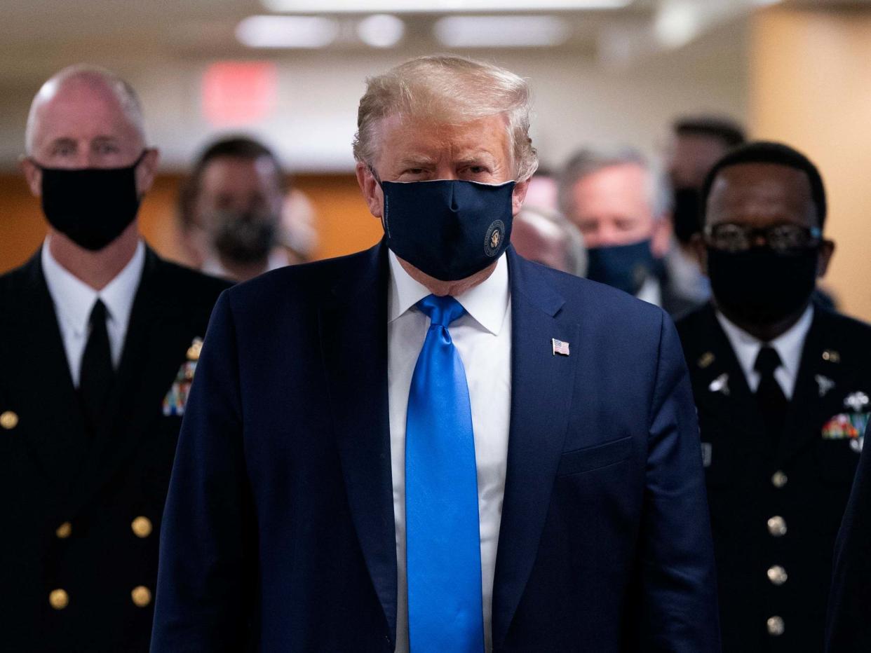 US president Donald Trump wears a face mask as he arrives to visit wounded military members and front line coronavirus healthcare workers at Walter Reed National Military Medical Centre in Bethesda, Maryland, USA, 11 July 2020: Chris Kleponis/Pool