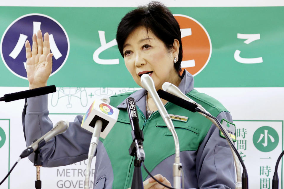 Tokyo Gov. Yuriko Koike attends a press conference in Tokyo Monday, Dec. 21, 2020. Koike on Monday asked all residents to celebrate Christmas and New Year at home just with their families, and asked organizers to light-up events to close early in the night. (Yuki Sato/Kyodo News via AP)