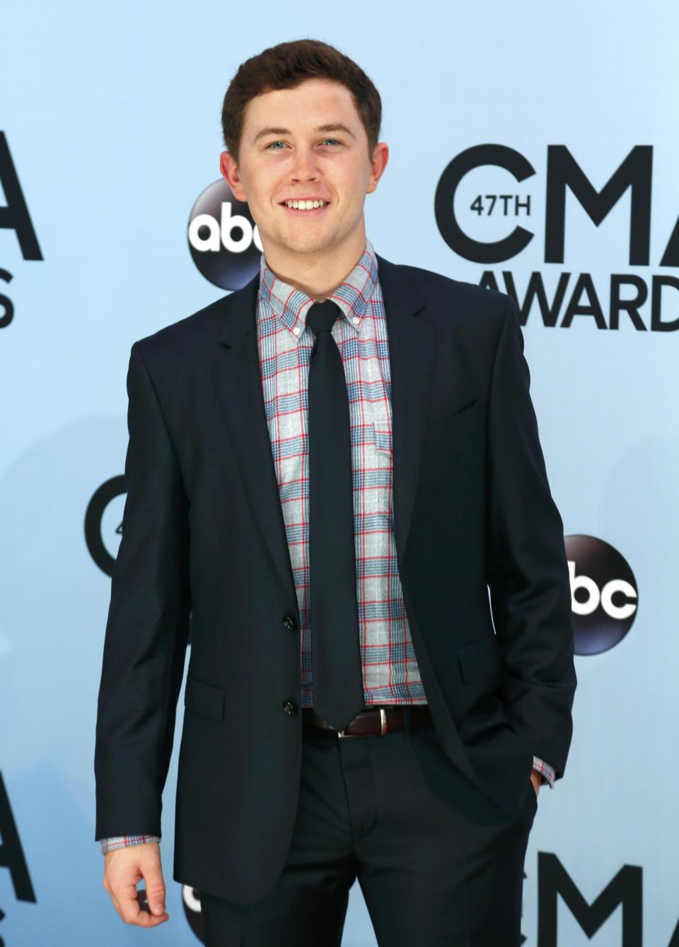 Scotty McCreery poses on arrival at the 47th Country Music Association Awards in Nashville, Tennessee November 6, 2013. REUTERS/Eric Henderson (UNITED STATES - Tags: ENTERTAINMENT)