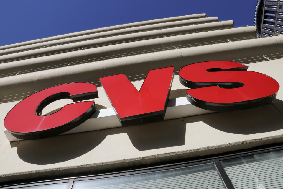 FILE - This Friday, Jan. 26, 2018, file photo shows a sign at a CVS Pharmacy in Pittsburgh. Drugstore chains Walgreens and CVS Health say they will stop locking up beauty and hair care products aimed at black women and other women of color. (AP Photo/Gene J. Puskar, File)