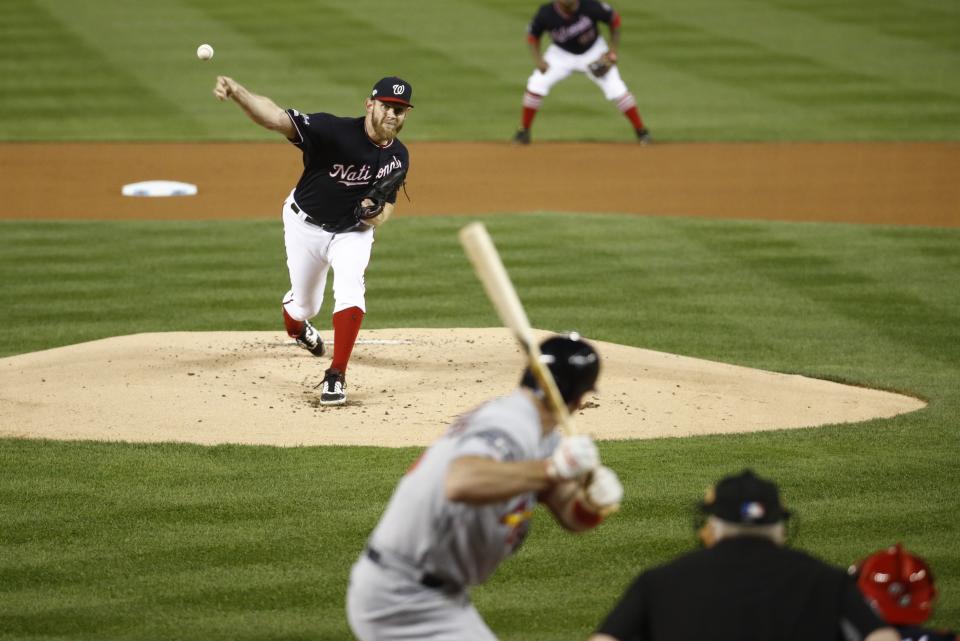 Washington Nationals starting pitcher Stephen Strasburg throws during the first inning of Game 3 of the baseball National League Championship Series against the St. Louis Cardinals Monday, Oct. 14, 2019, in Washington. (AP Photo/Patrick Semansky)