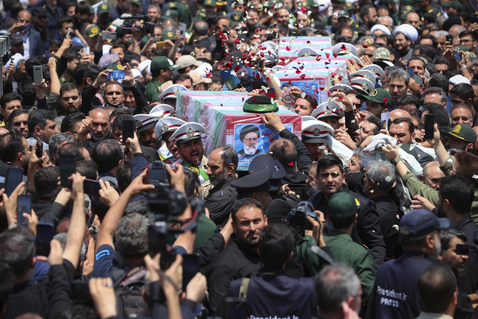 In this photo released by the Iranian Presidency Office, flag-draped coffins of the President Ebrahim Raisi and his companions who were killed in a helicopter crash on Sunday, during their funeral ceremony in the city of Mashhad, Iran, Thursday, May 23, 2024. Iran on Thursday prepared to inter its late president at the holiest site for Shiite Muslims in the Islamic Republic, a final sign of respect for a protégé of Iran's supreme leader killed in a helicopter crash earlier this week. (Iranian Presidency Office via AP)