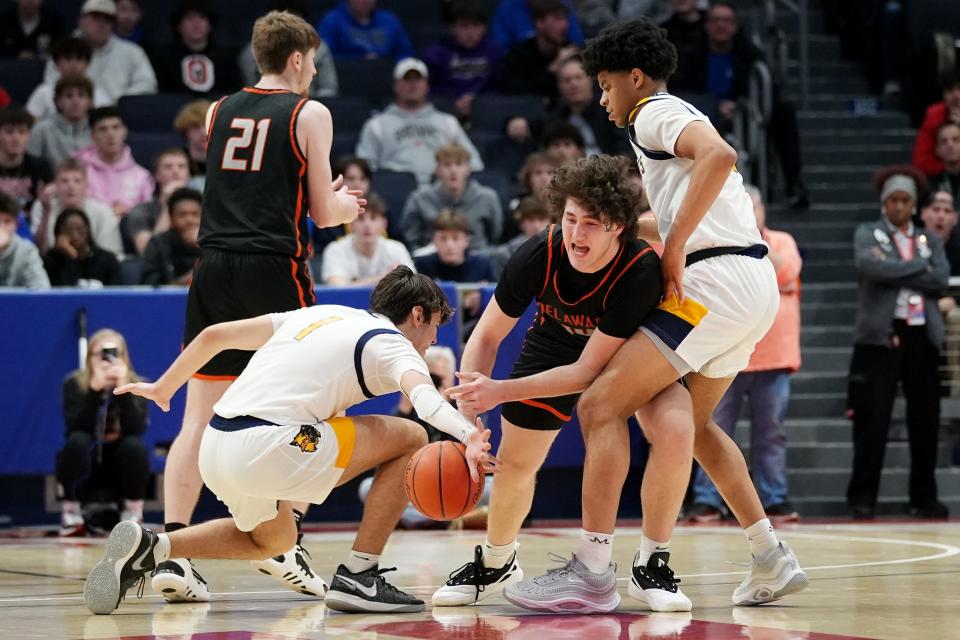 Delaware Hayes' Jake Lowman (14) loses the ball against Cleveland St. Ignatius on Saturday.