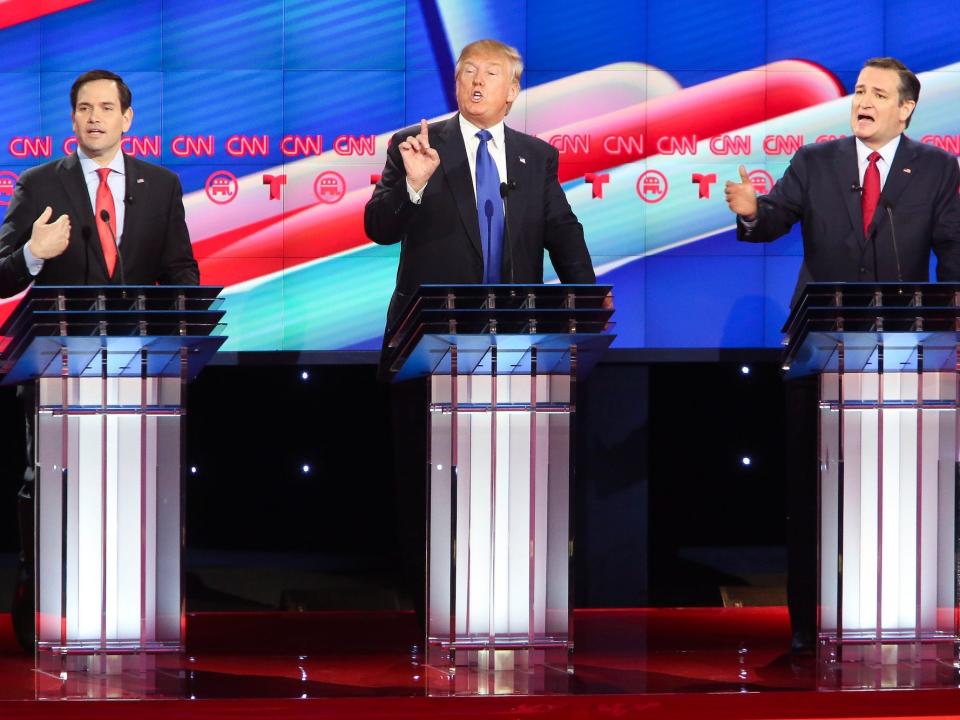 Marco Rubio, Donald Trump, and Ted Cruz gesture on the debate stage during the 2016 GOP presidential primaries.