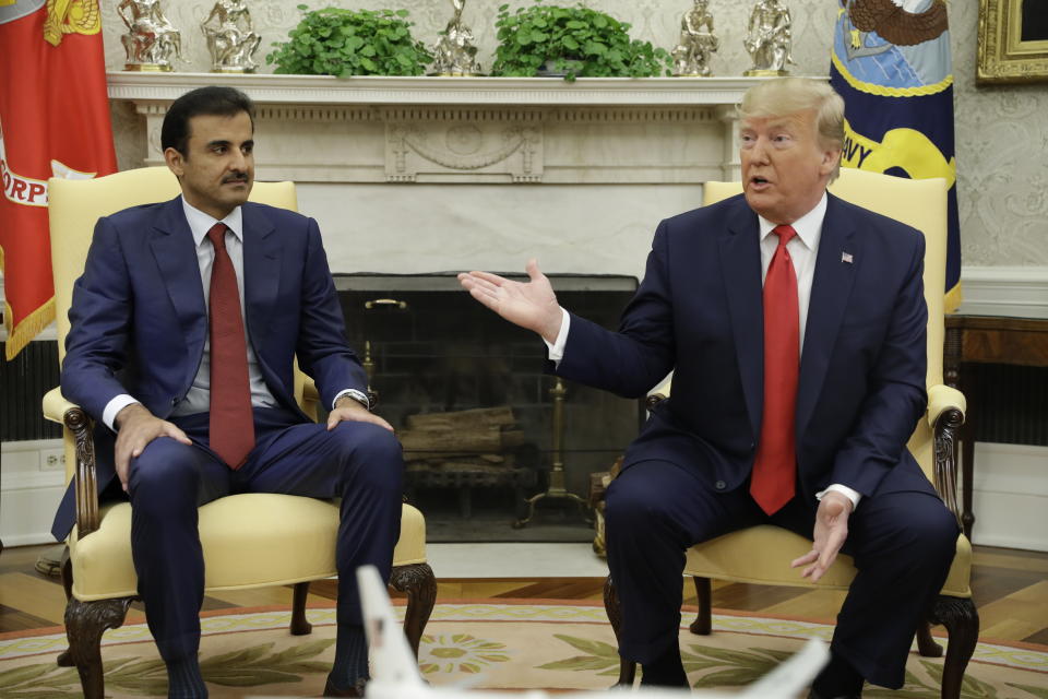 President Donald Trump meets with Qatar's Emir Sheikh Tamim Bin Hamad Al-Thani in the Oval Office of the White House, Tuesday, July 9, 2019, in Washington. (AP Photo/Evan Vucci)