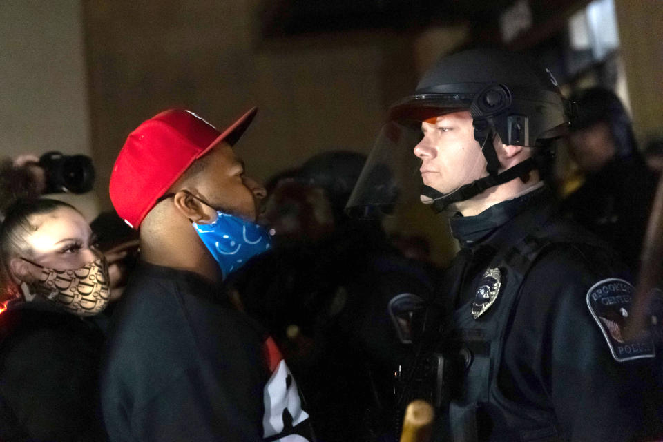 Image: Protesters confront a line of police officers (Kerem Yucel / AFP - Getty Images)