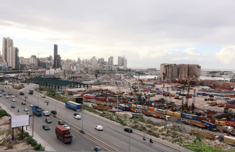 FILE PHOTO: Vehicles drive near the site of the Aug. 4 explosion at Beirut port, in Beirut