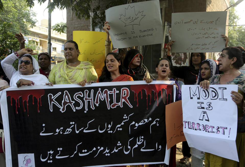 Pakistani transgender persons chant anti India slogans during a demonstration to express solidarity with Indian Kashmiris, in Lahore, Pakistan, Saturday, Aug. 24, 2019. Pakistan's Foreign Minister Shah Mahmood Qureshi said in Islamabad that he spoke with United Nations Secretary General António Guterres and discussed India's human rights violations and the security situation in Indian-controlled Kashmir. The banner read 'We strongly condemn the oppression against innocent Kashmiris'. (AP Photo/K.M. Chaudary)