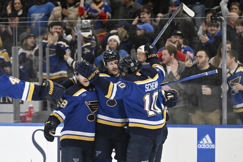St. Louis Blues' Marco Scandella (6) celebrates with teammates after scoring a goal against the Dallas Stars during the second period of an NHL hockey game Wednesday, Dec. 27, 2023, in St. Louis. (AP Photo/Michael Thomas)