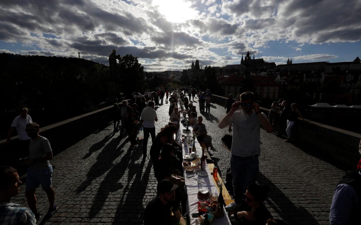 Czechs at the 'farewell to coronavirus' party in July in Prague - AP