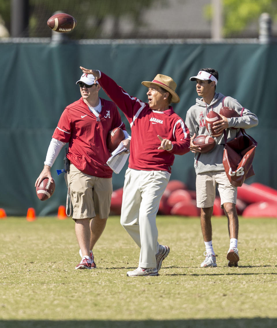 Alabama head coach Nick Saban, center, works with his players, throwing interception drills, during NCAA college spring football practice, Thursday, April 19, 2018, in Tuscaloosa, Ala. (Vasha Hunt/AL.com via AP)