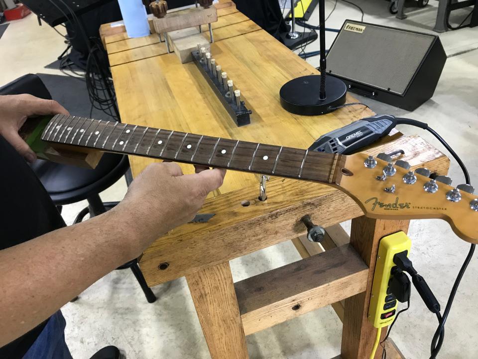 Jim Jaros repairing a Fender guitar.