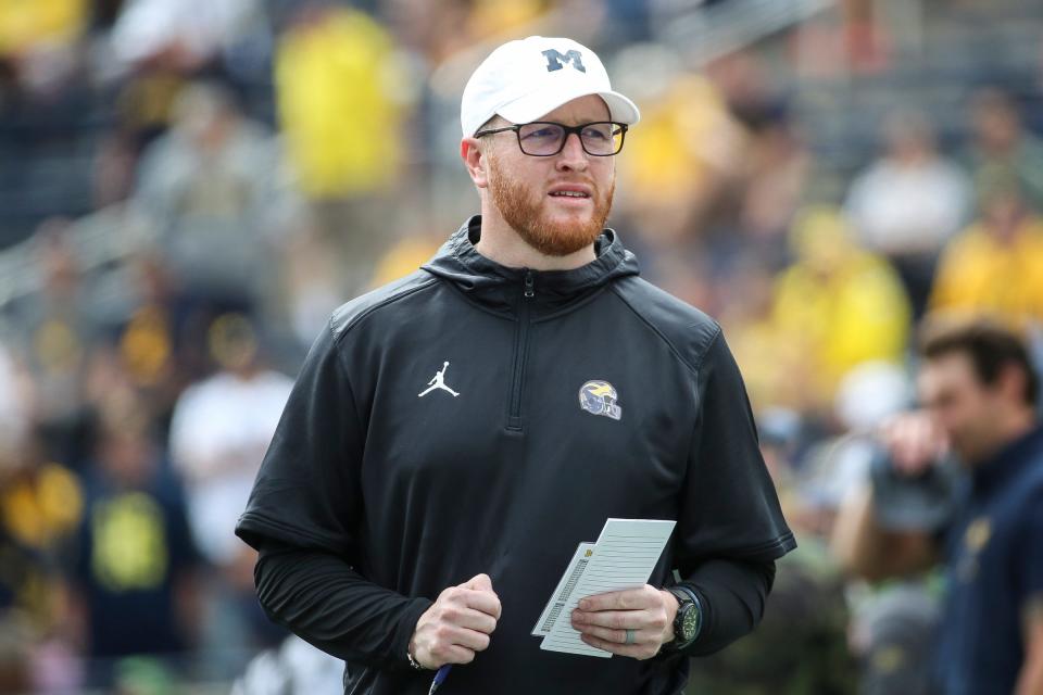 Michigan acting head coach (first half) Jay Harbaugh watches practice before the UNLV game at Michigan Stadium in Ann Arbor on Saturday, Sept. 9, 2023.