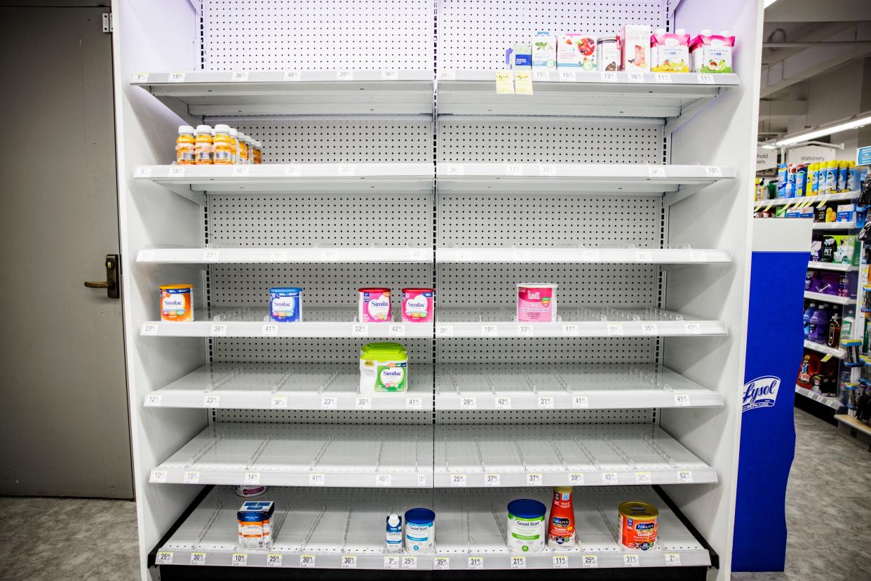 Shelves normally meant for baby formula sit nearly empty at a store in downtown Washington, DC, on May 22, 2022. - A US military plane bringing several tons of much-needed baby formula from Germany landed on May 22, 2022, at an airport in Indiana as authorities scramble to address a critical shortage. (Photo by Samuel Corum / AFP) (Photo by SAMUEL CORUM/AFP via Getty Images)