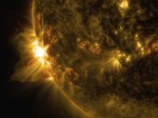 A solar flare bursts off the left limb of the sun in this image captured by NASA's Solar Dynamics Observatory at 07:41 EST (11:41 GMT) June 10, 2014, This is classified as an X2.2 flare, shown in a blend of two wavelengths of light: 171 and 131 angstroms, colorized in gold and red, respectively, according to a NASA news release. REUTERS/NASA/SDO/Goddard/Wiessinger/Handout via Reuters