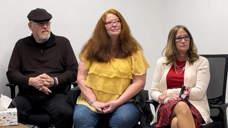 Susan Lund’s siblings are pictured listening to Friday’s news conference where authorities revealed Lund as a 1993 homicide victim. From left to right is Charles Menard, Pamela Reyes and Ann Marie Miley.