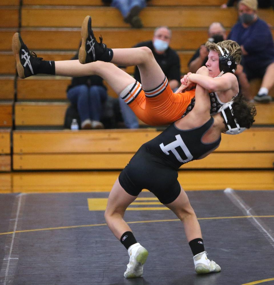 Nate Dulcie (bottom) of Perry defeated Alex Boske of Hoover in a 120 pound bout at Perry on Thursday, Jan. 14, 2021.