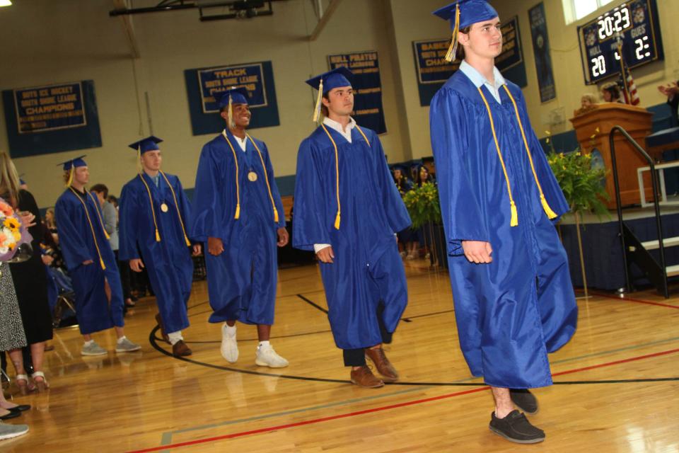 Students walk into the gym during Hull High School's graduation on Saturday, June 3, 2023.