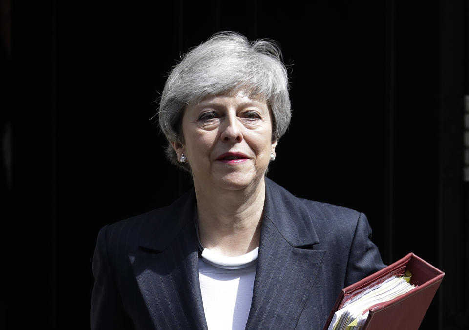 Britain's Prime Minister Theresa May leaves 10 Downing Street to attend the weekly session of Prime Ministers Questions in Parliament in London, Wednesday, May 22, 2019. (AP Photo/Kirsty Wigglesworth)